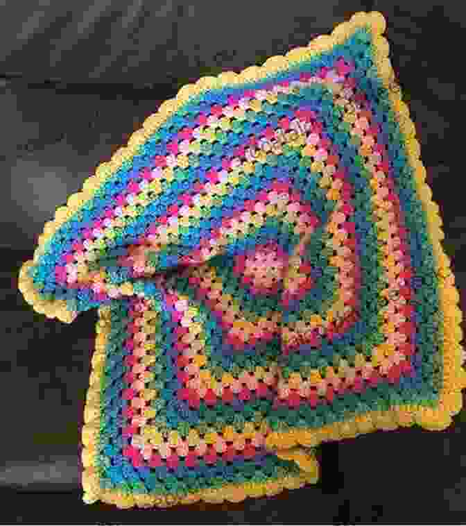 A Cozy And Colorful Crocheted Granny Square Blanket In Various Yarn Colors Homemade Knit Sew And Crochet: 25 Home Craft Projects