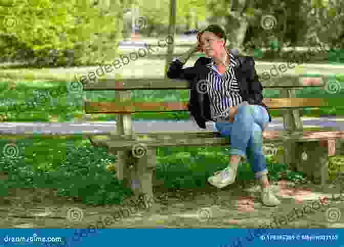 A Young Woman Sitting Alone On A Park Bench, Looking Sad And Lost. She Is Surrounded By Nature. Forgetting You L A Casey