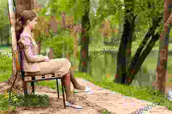 A Young Woman Sitting On A Bench In The Park, Looking Happy And Content. She Is Surrounded By Nature. Forgetting You L A Casey