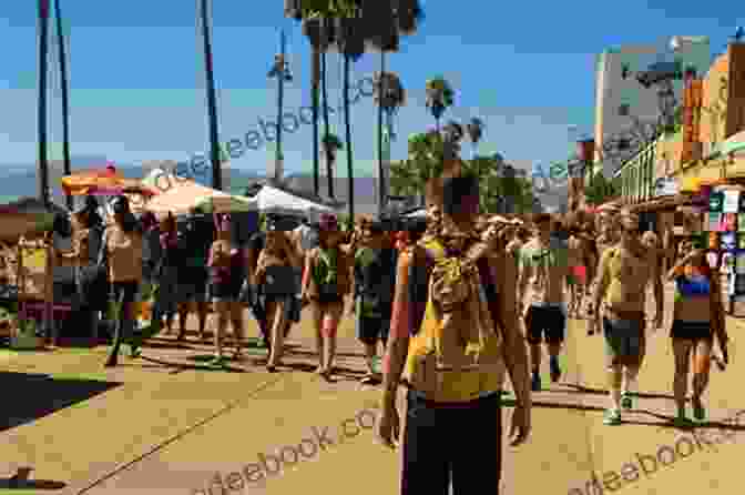 People Gathered On The Venice Beach Boardwalk Venice: A Contested Bohemia In Los Angeles